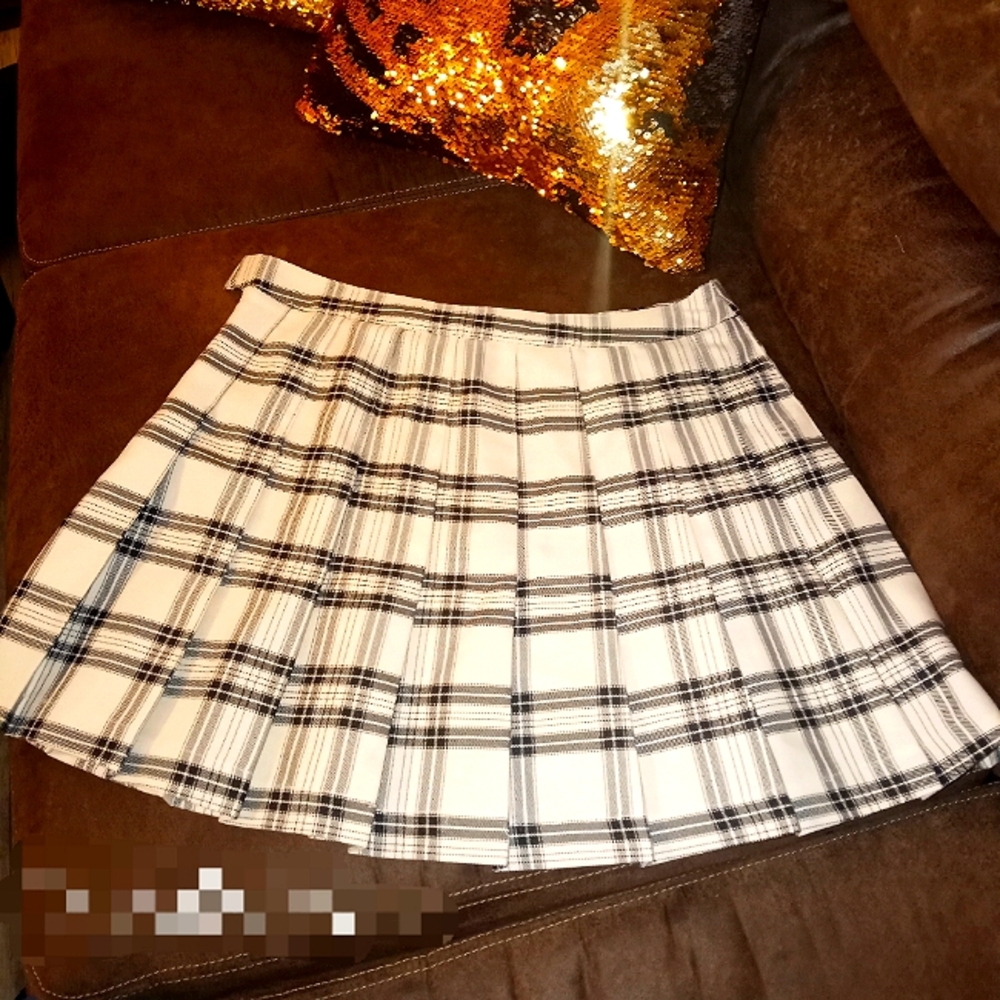 Large black and white plaid pleated skirt
